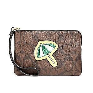 COACH Corner zip wristlet with umbrella